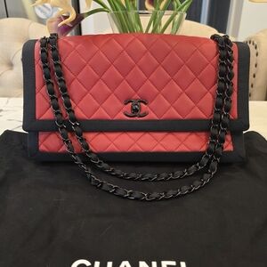 CHANEL Red Quilted Shoulder Bag with Black Trim and Chain Strap